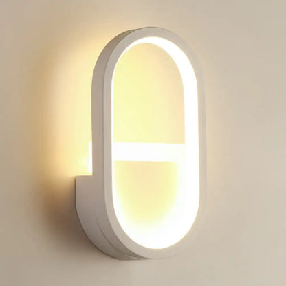 White Elliptical LED Wall Sconce by Decorbites with glowing oval frame on Tampa Home & Garden Store
