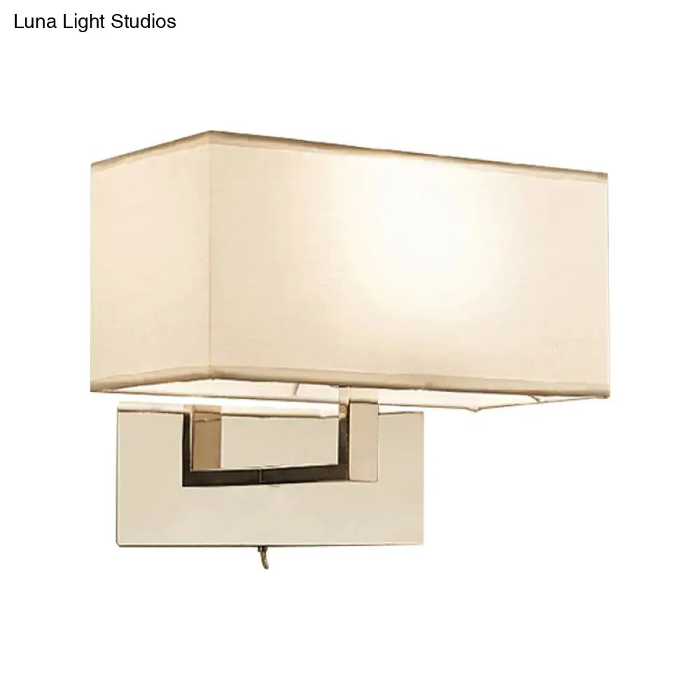 White brass wall sconce with rectangular ivory shade and square brass mount on Tampa Home & Garden Store
