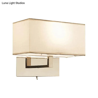 White brass wall sconce with rectangular ivory shade and square brass mount on Tampa Home & Garden Store