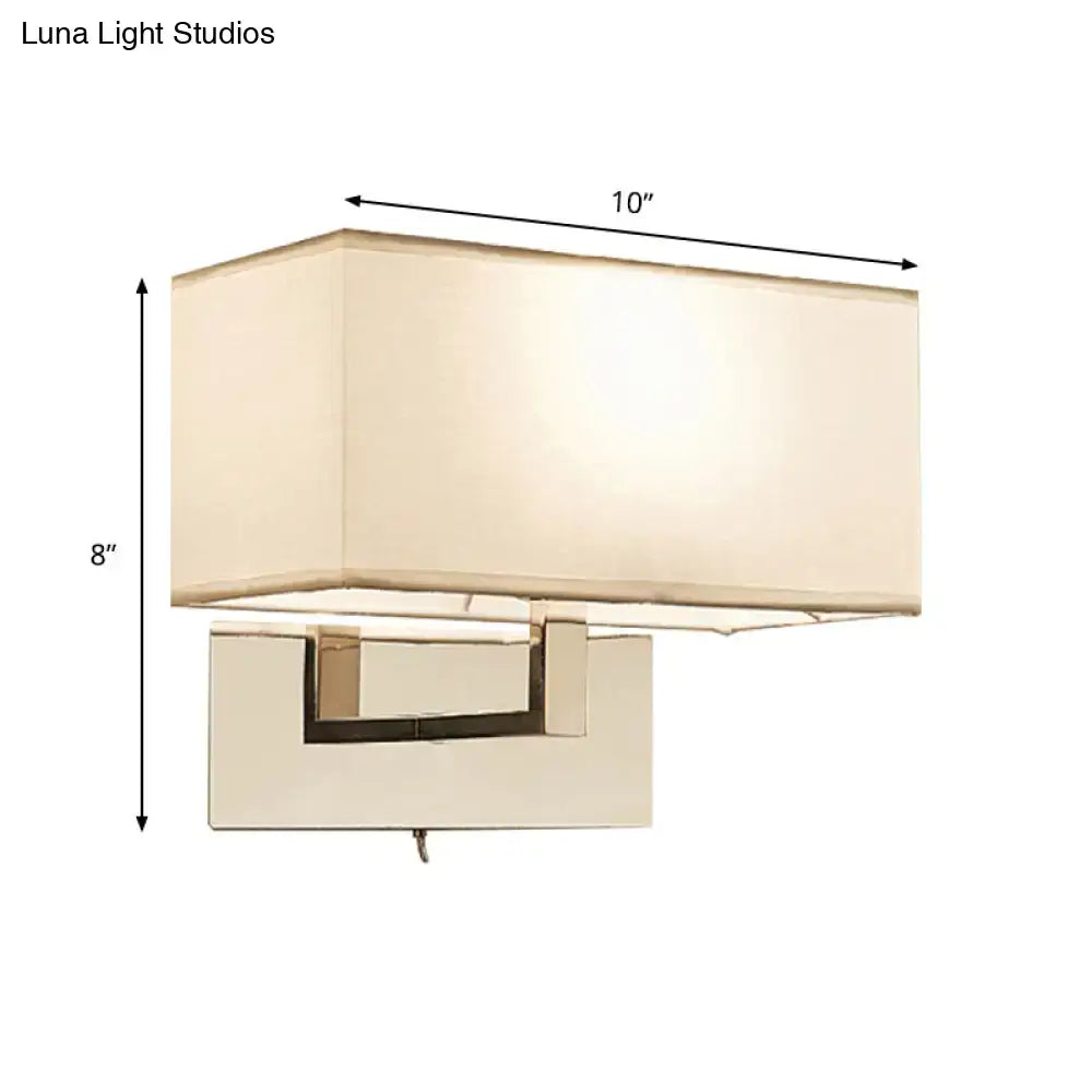 White brass wall sconce with cream fabric shade and rectangular backplate by Decorbites on Tampa Home & Garden Store