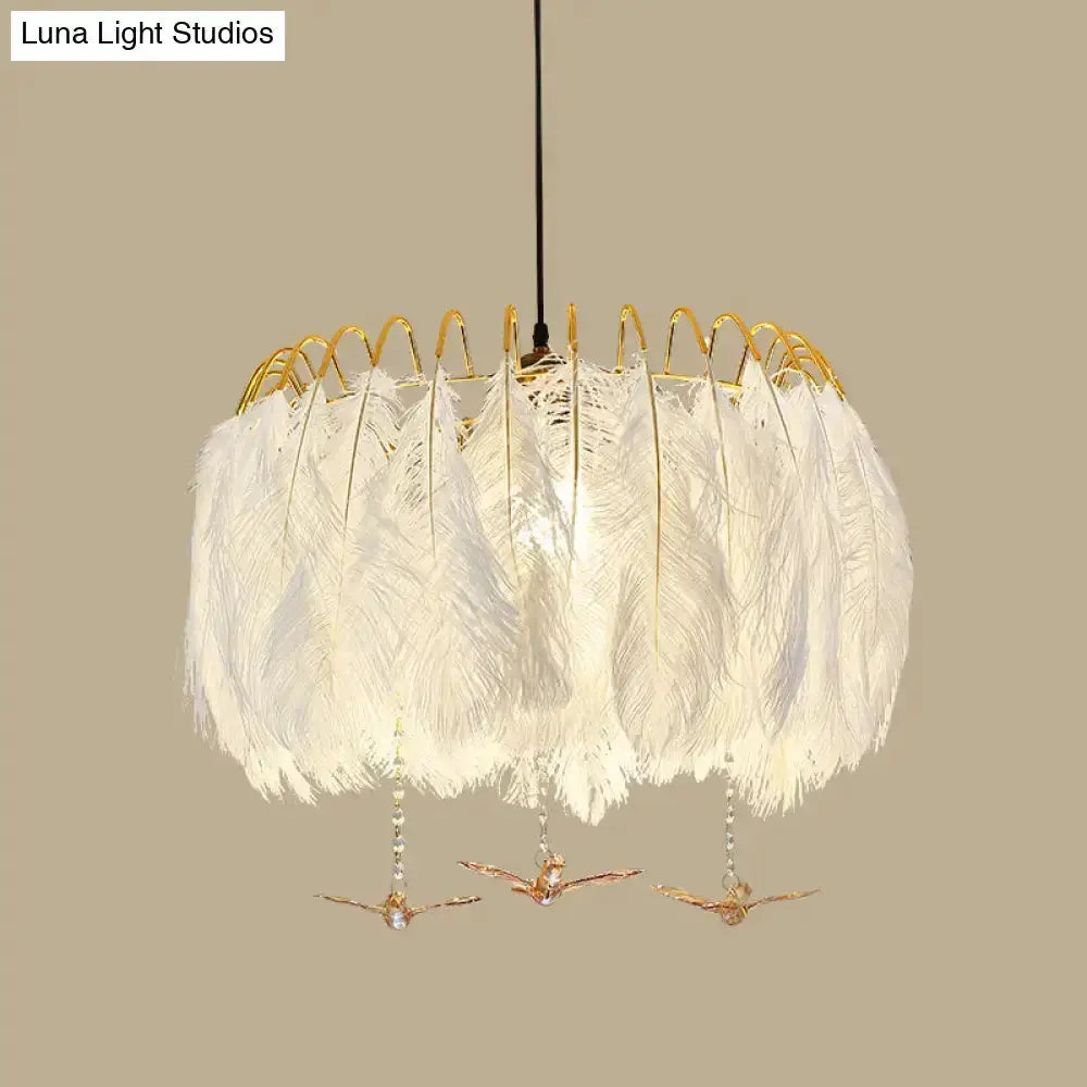 Modern white feather chandelier with gold wire frame pendant light and crystal bird accents on Tampa Home & Garden Store