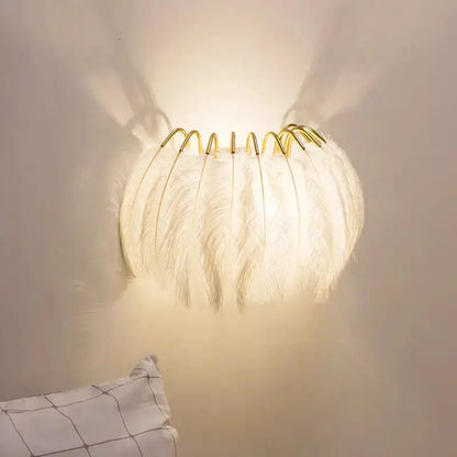 Modern white feather metal wall sconce with gold frame for bedroom lighting by Decorbites on Tampa Home & Garden Store