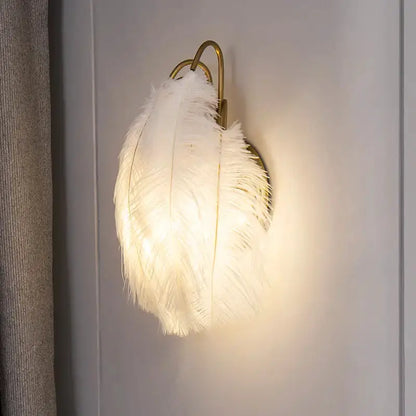 Modern white feather metal wall sconce by Decorbites with gold mount for bedroom lighting on Tampa Home & Garden Store
