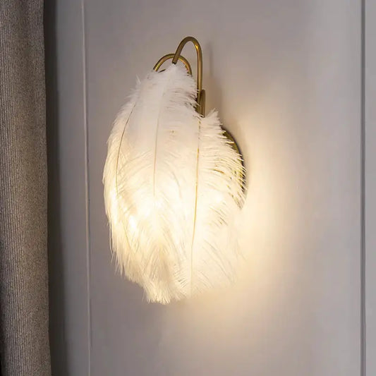 Modern white feather metal wall sconce by Decorbites with gold mount for bedroom lighting on Tampa Home & Garden Store
