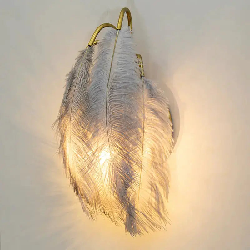 Modern white feather metal wall sconce by Decorbites with gold frame warm illumination on Tampa Home & Garden Store