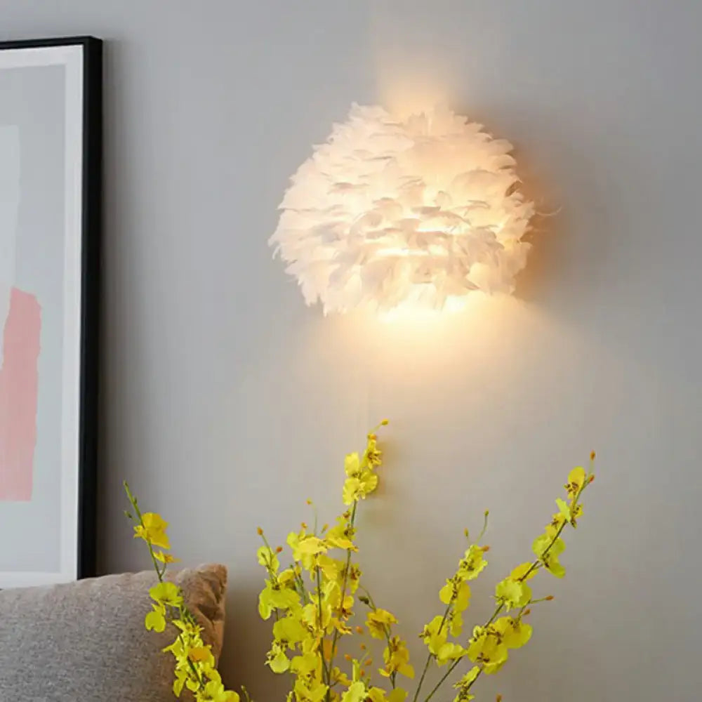 White Feather Bedroom Sconce by Decorbites, spherical feather wall light with warm glow on Tampa Home & Garden Store