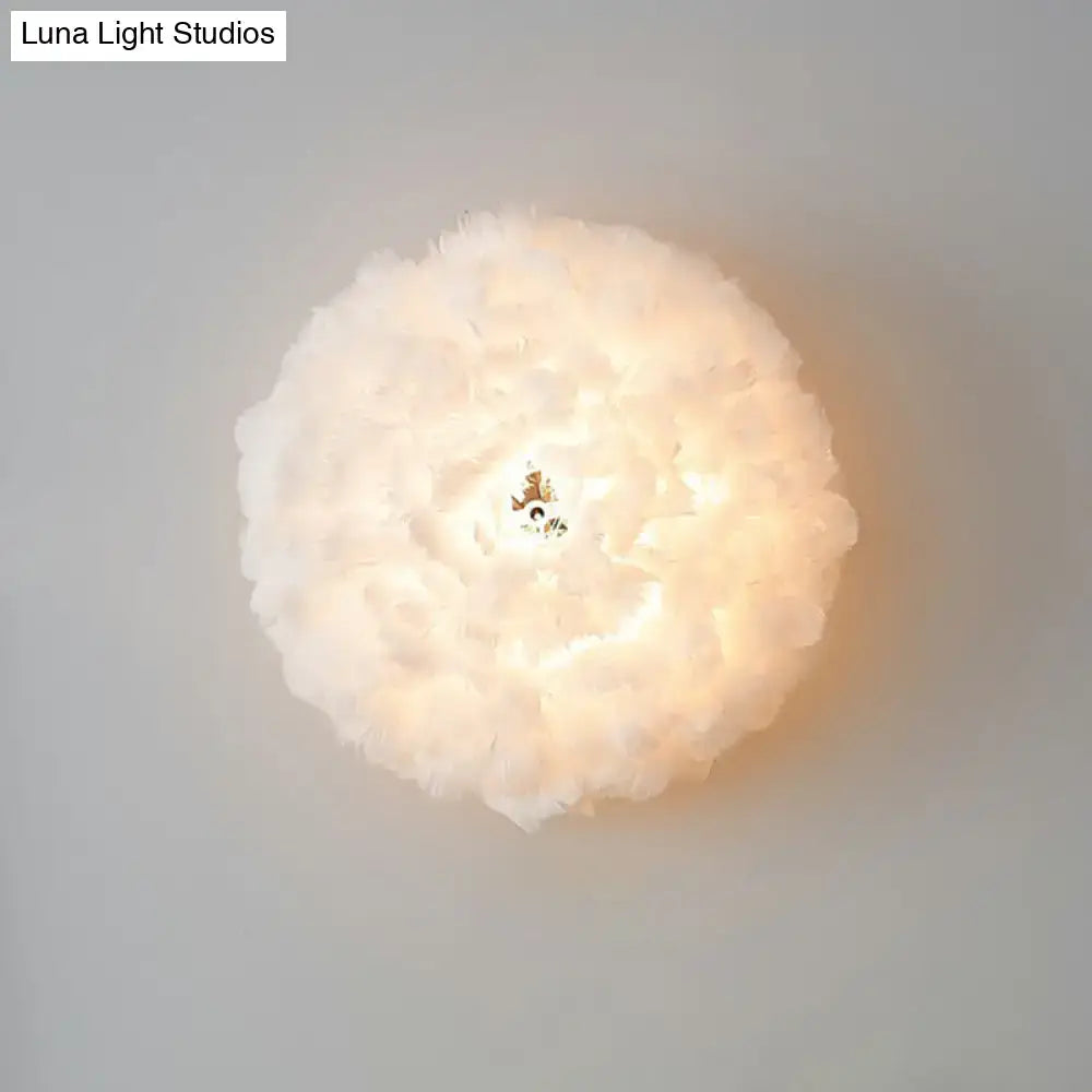 White feather bedroom sconce with fluffy spherical shade by Decorbites on Tampa Home & Garden Store