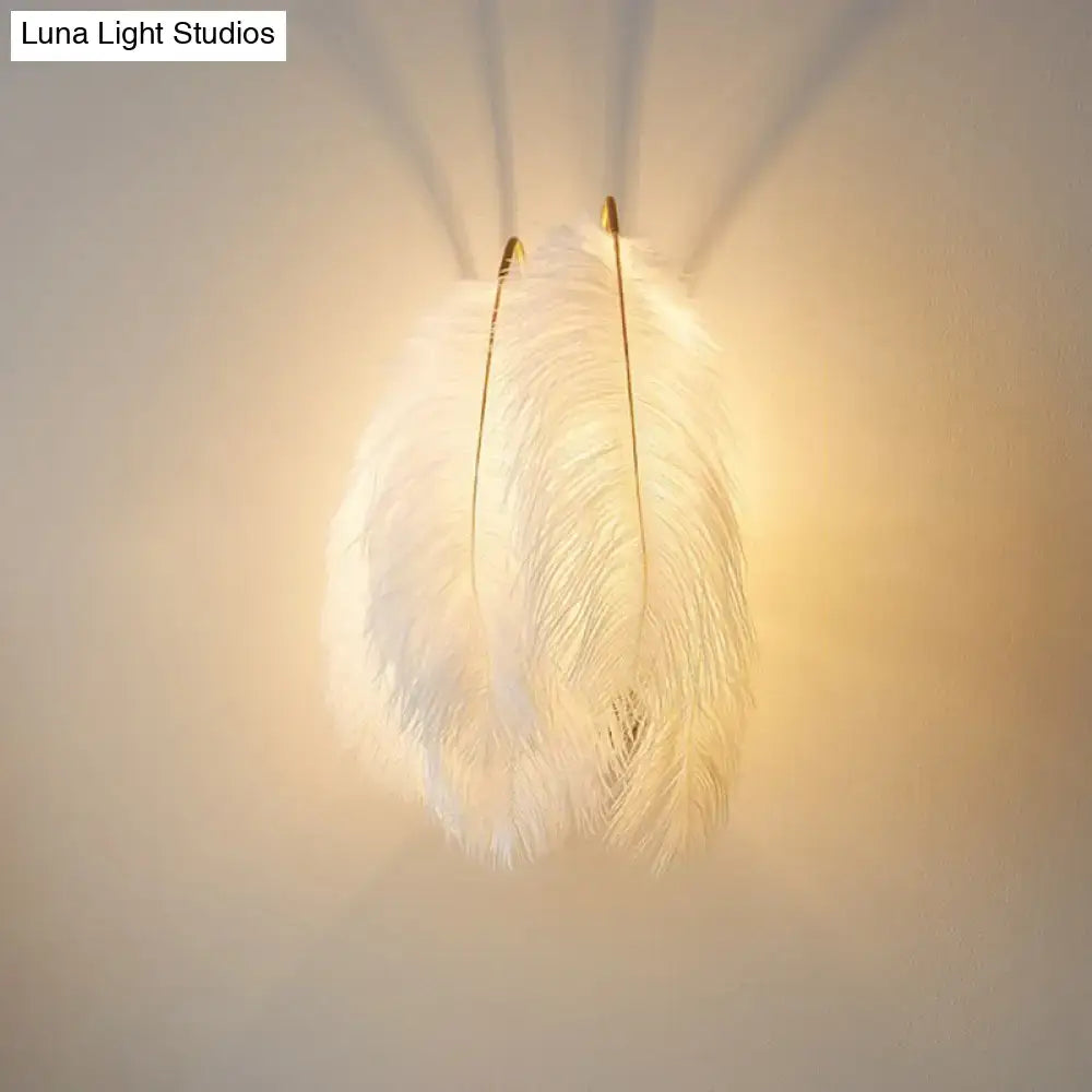 White Feather Bedroom Sconce with gold-tone arms by Decorbites, warm glow on Tampa Home & Garden Store
