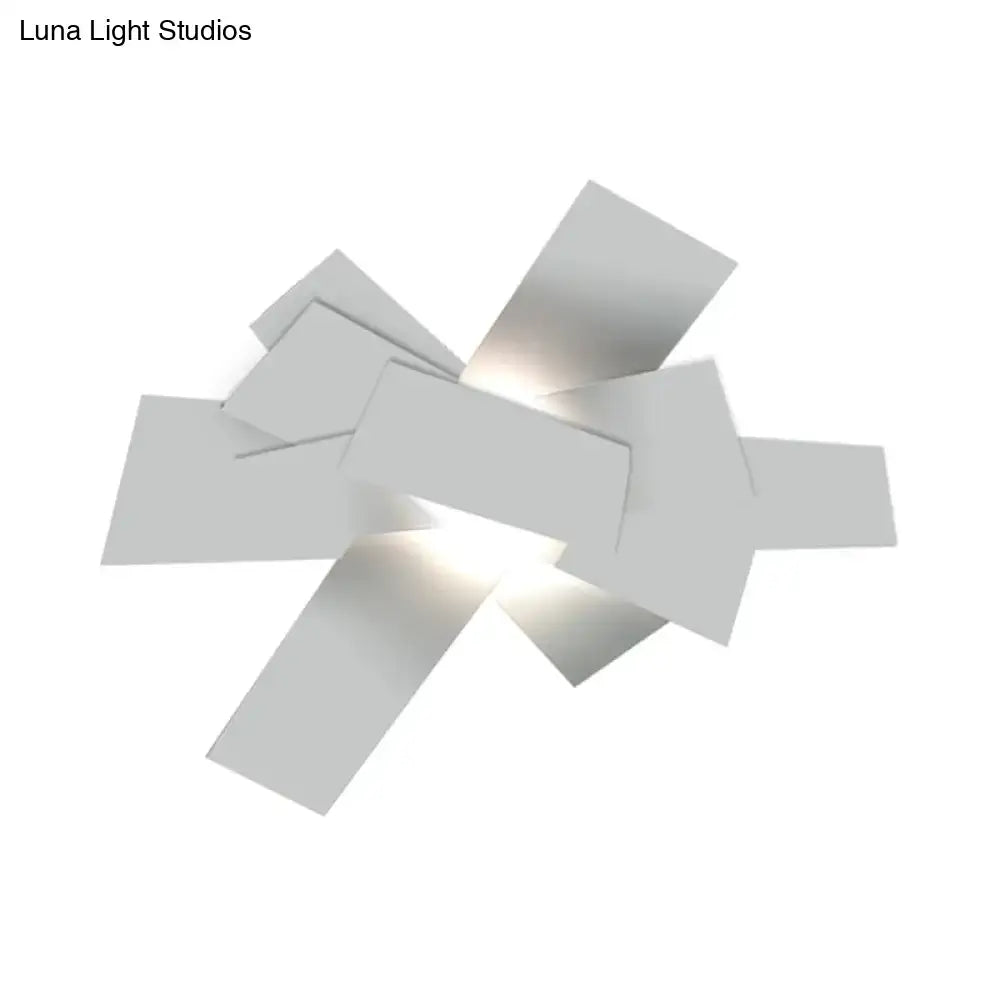 White geometric ceiling light fixture with interlocking rectangular panels by Decorbites on Tampa Home & Garden Store