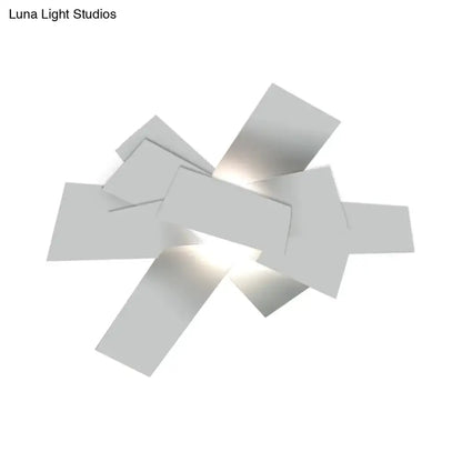 White geometric ceiling light fixture with interlocking rectangular panels by Decorbites on Tampa Home & Garden Store