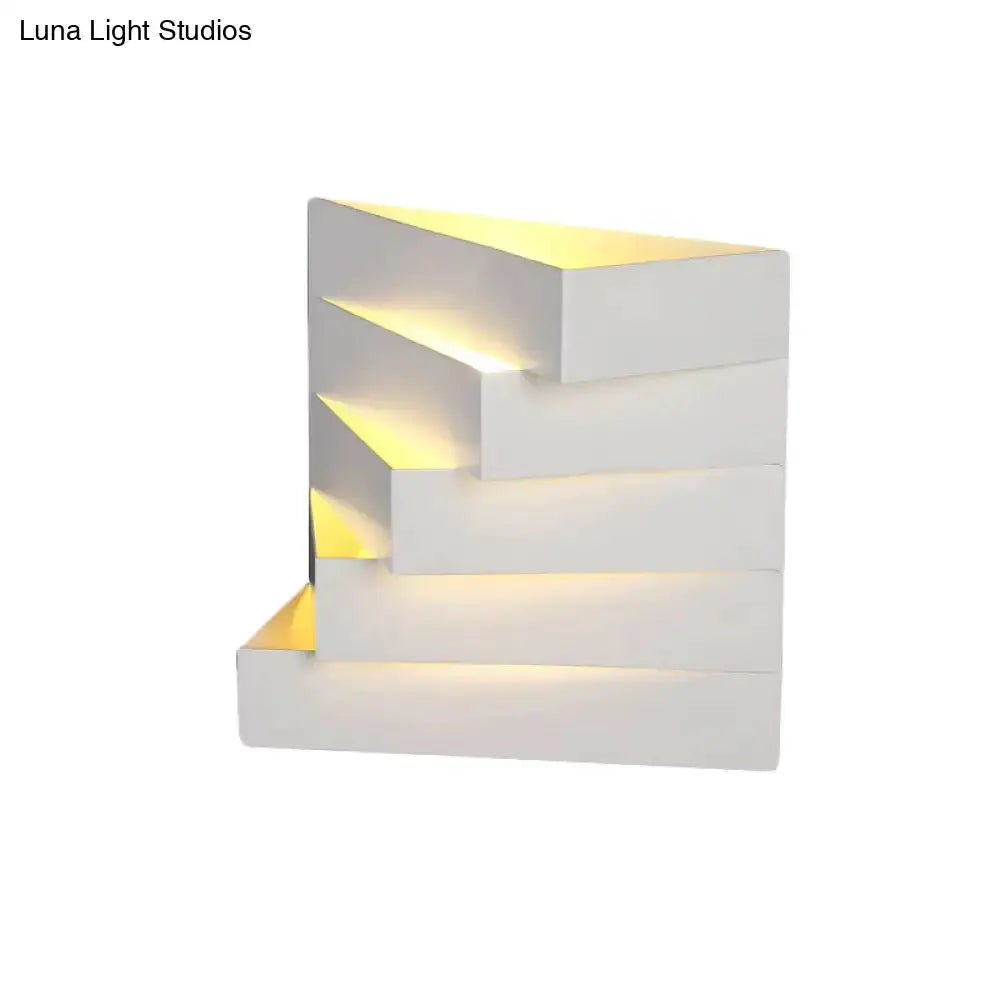 White geometric wall mounted sconce with stepped blocks and warm LED glow Decorbites on Tampa Home & Garden Store