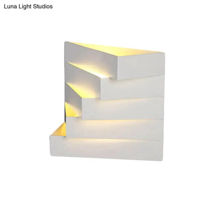 White geometric wall mounted sconce with stepped blocks and warm LED glow Decorbites on Tampa Home & Garden Store