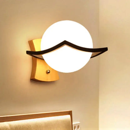 White glass ball sconce with black accent arc, Decorbites wall light on Tampa Home & Garden Store