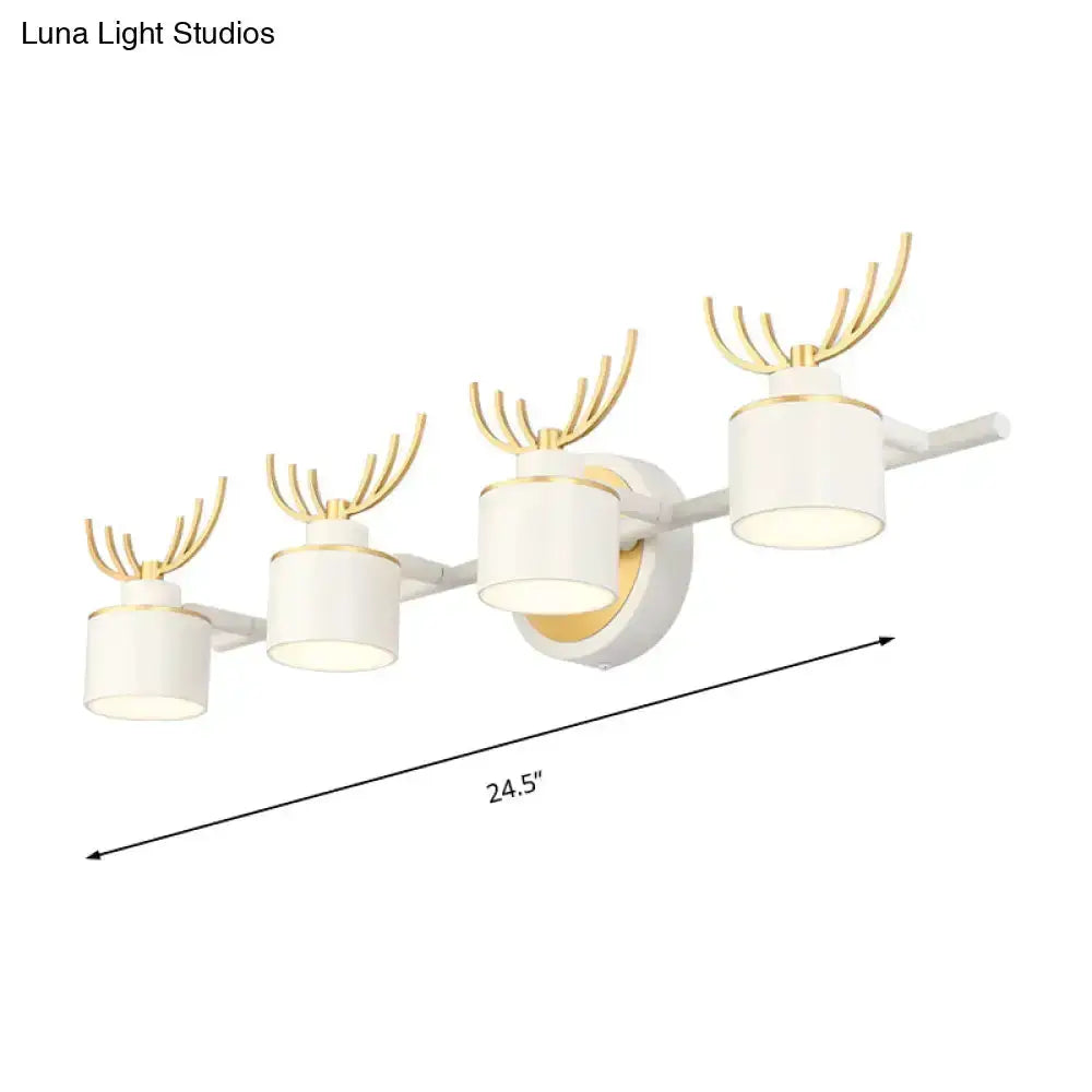Modern white and gold antler wall light fixture with four cylindrical LED shades on Tampa Home & Garden Store