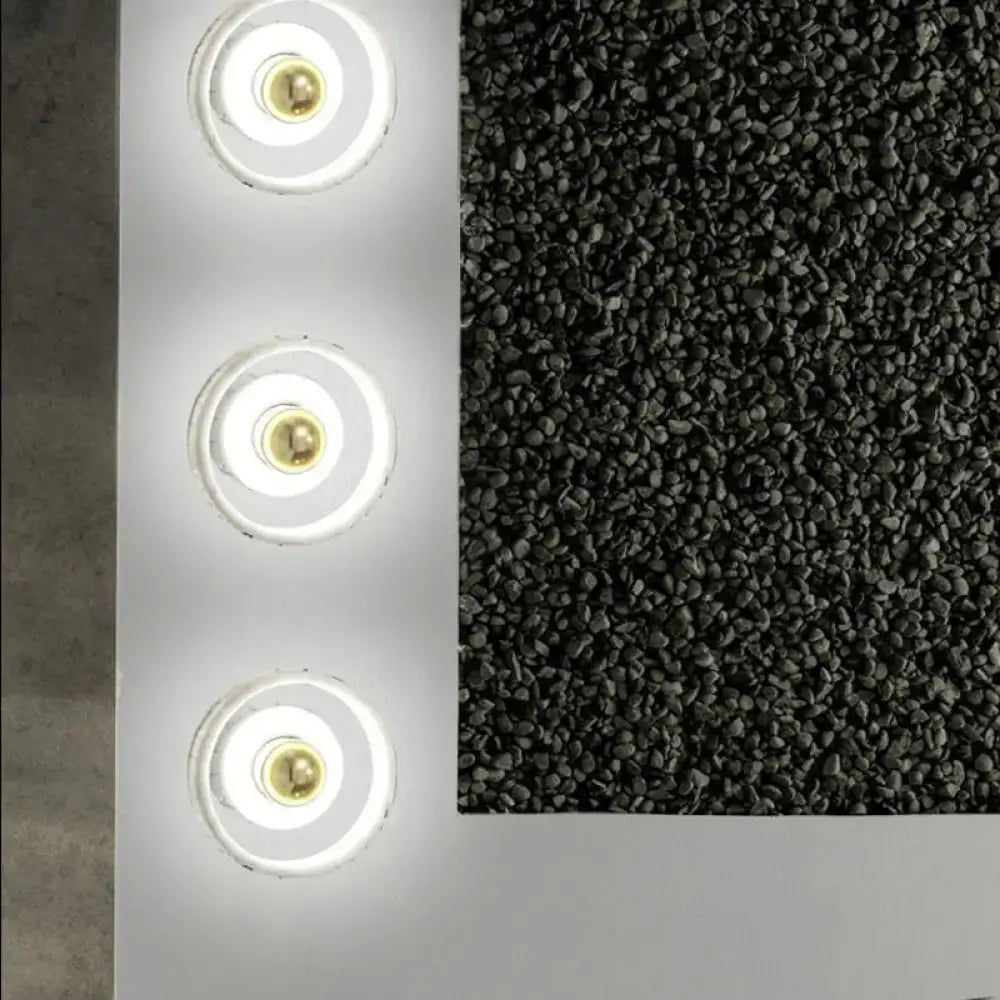 White Gold Wall Sconce by Decorbites with three circular LED rings and brass centers on a panel on Tampa Home & Garden Store