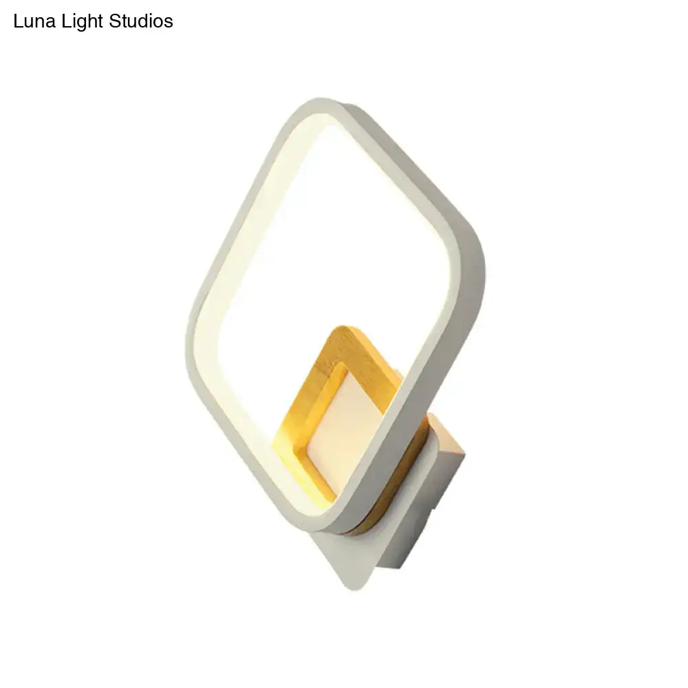 White metal minimalist LED wall sconce with warm glow and gold inner accent by Decorbites on Tampa Home & Garden Store