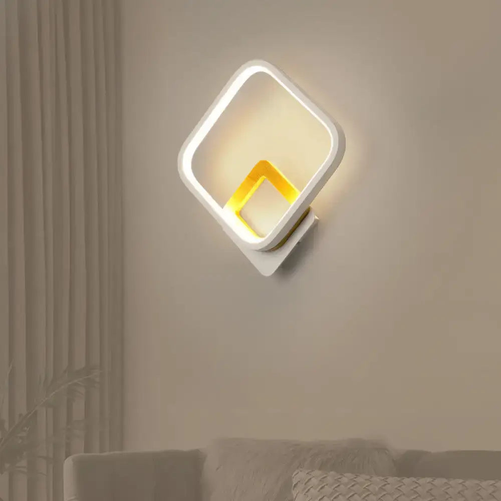 White metal minimalist LED wall sconce with double square frames and warm glow Decorbites on Tampa Home & Garden Store