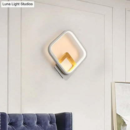 White metal minimalist LED wall sconce by Decorbites with a gold-tone nested inner square on Tampa Home & Garden Store