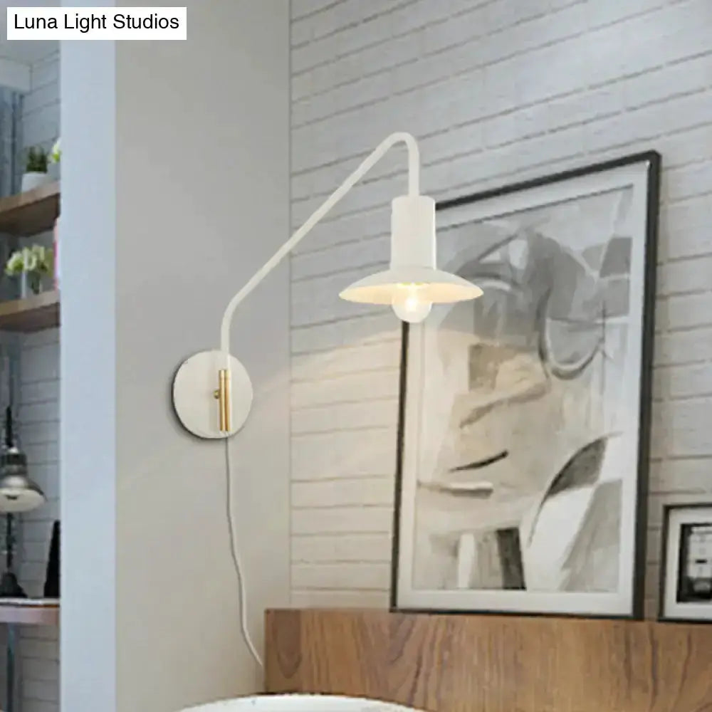 Modern white and gold metal wide-flare bedroom wall light with curved arm and shade on wall on Tampa Home & Garden Store