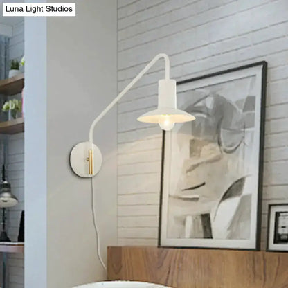 Modern white and gold metal wide-flare bedroom wall light with curved arm and shade on wall on Tampa Home & Garden Store