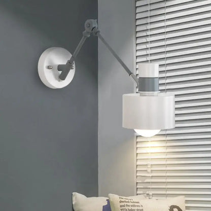 Gray adjustable wall sconce with white cylindrical shade and articulated arm Decorbites on Tampa Home & Garden Store