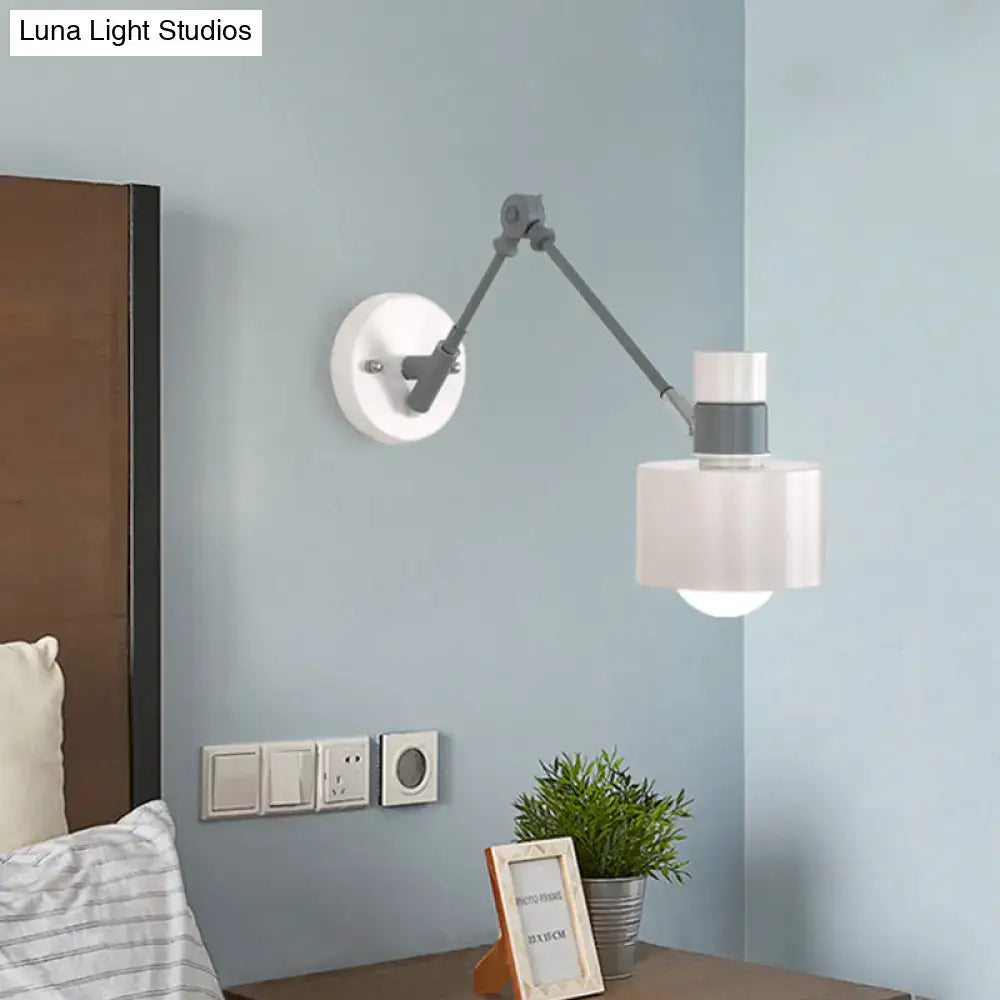 Gray adjustable wall sconce with white shade and articulated arm by Decorbites on blue wall on Tampa Home & Garden Store