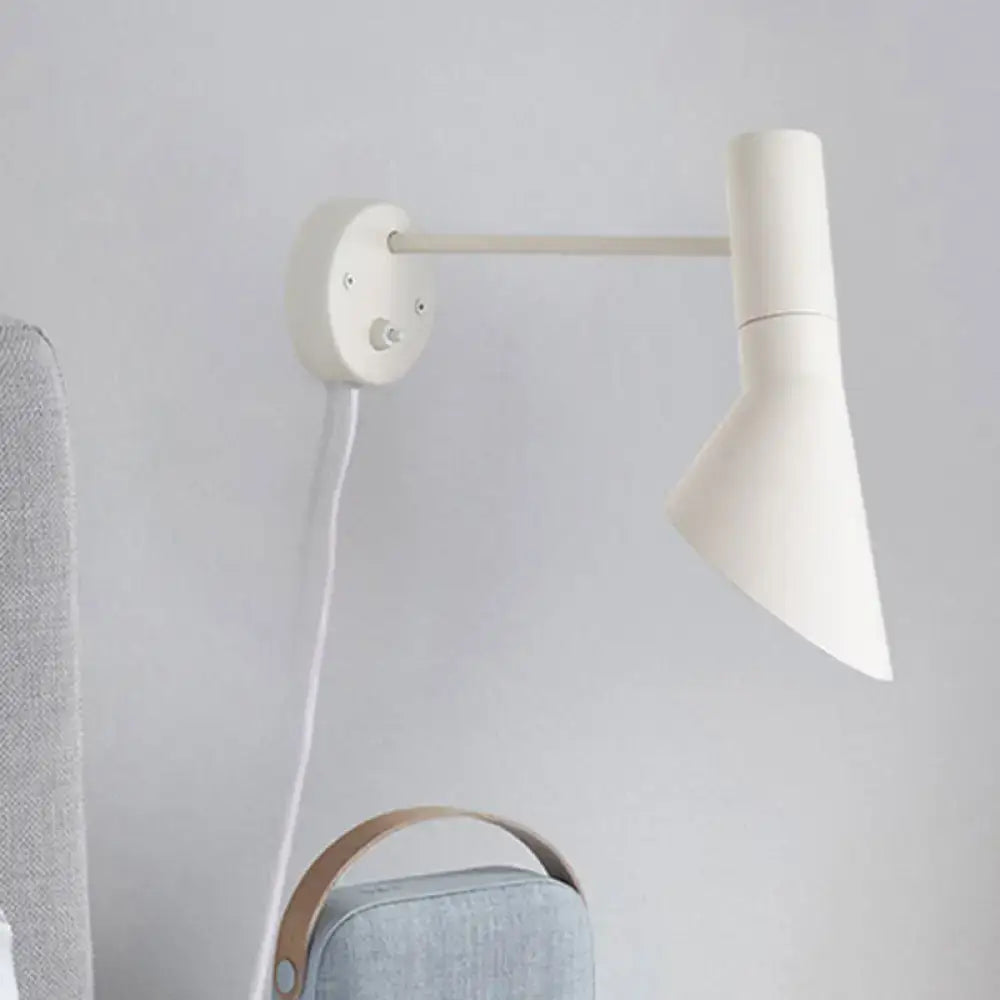 White rotating wall sconce by Decorbites with slim arm and conical shade on circular wall plate on Tampa Home & Garden Store