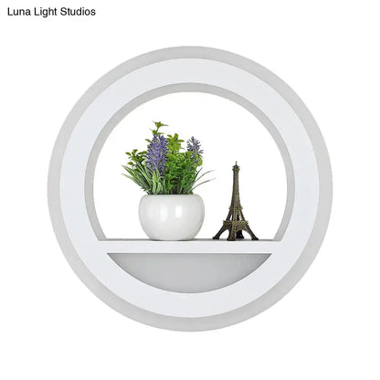 White halo wall light with circular ring shelf, Decorbites, plant and Eiffel Tower decor on shelf on Tampa Home & Garden Store