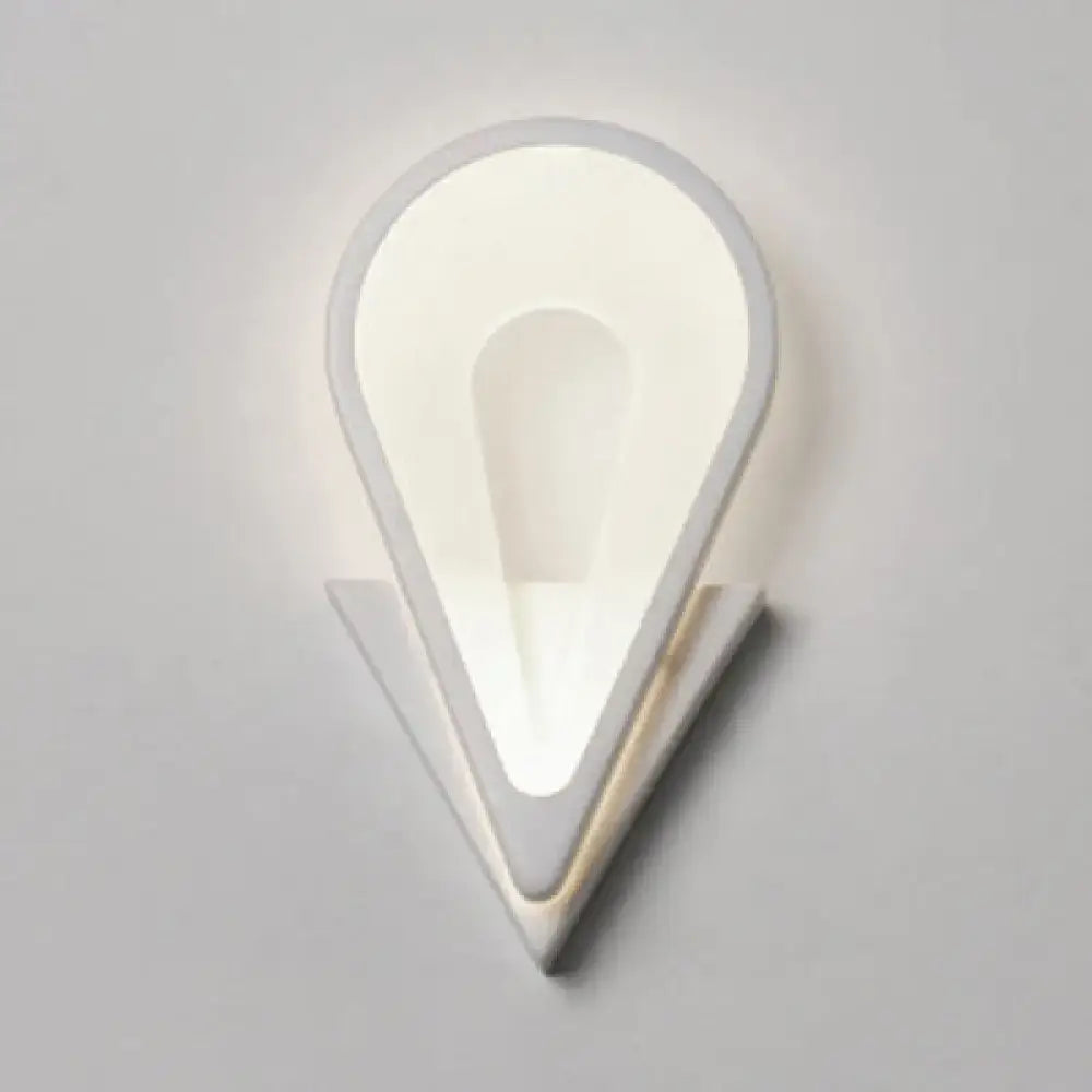 Modern white heart LED wall sconce with warm glow for a minimalist bedroom on Tampa Home & Garden Store