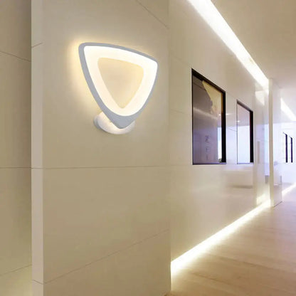 Modern white heart LED sconce by Decorbites, hollow heart frame, minimalist bedroom light on Tampa Home & Garden Store