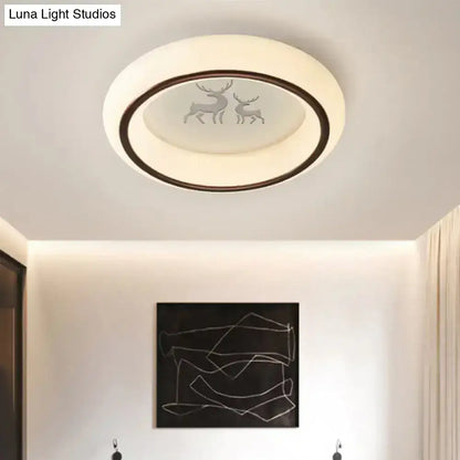 White balloon ceiling light flush mount with frosted center and dark ring, deer motif on Tampa Home & Garden Store