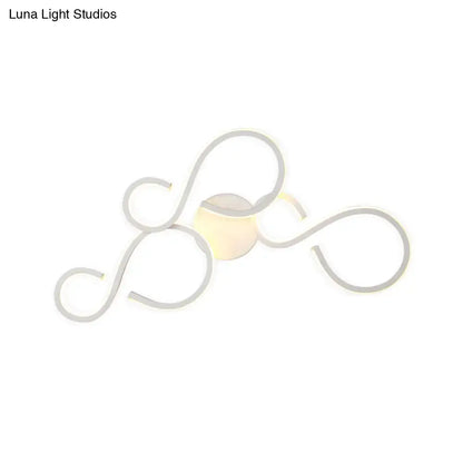 White Infinity Spiral Wall Light by Decorbites, white metal design with a warm glow on Tampa Home & Garden Store