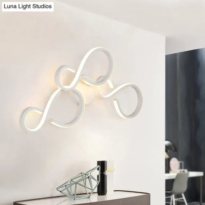 White Infinity Spiral Wall Light by Decorbites, illuminated looped design on white wall on Tampa Home & Garden Store