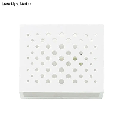 White laser-cut gypsum cube sconce with circular perforations by Decorbites on Tampa Home & Garden Store