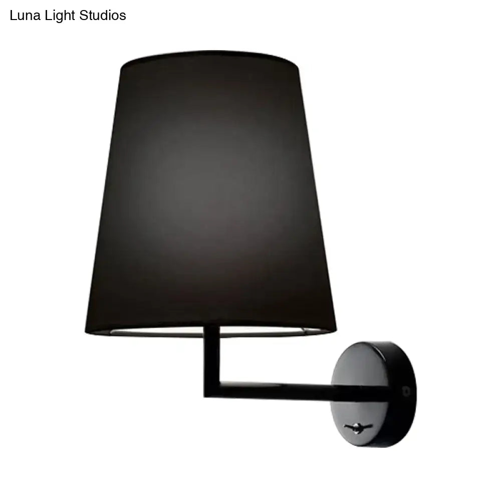 White fabric cone LED wall sconce by Decorbites, wall-mounted with black metal arm on Tampa Home & Garden Store
