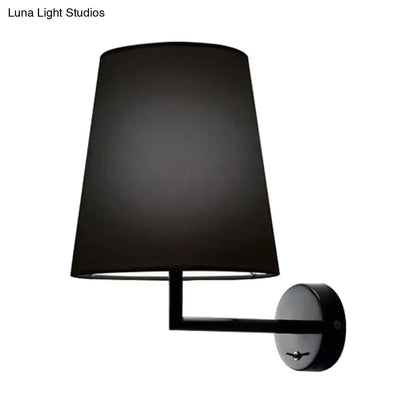 White fabric cone LED wall sconce by Decorbites, wall-mounted with black metal arm on Tampa Home & Garden Store