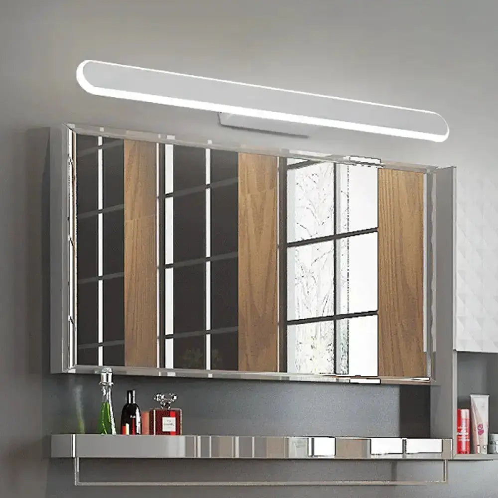 Modern white LED bath mirror light above a wood panel mirrored cabinet with chrome shelf on Tampa Home & Garden Store