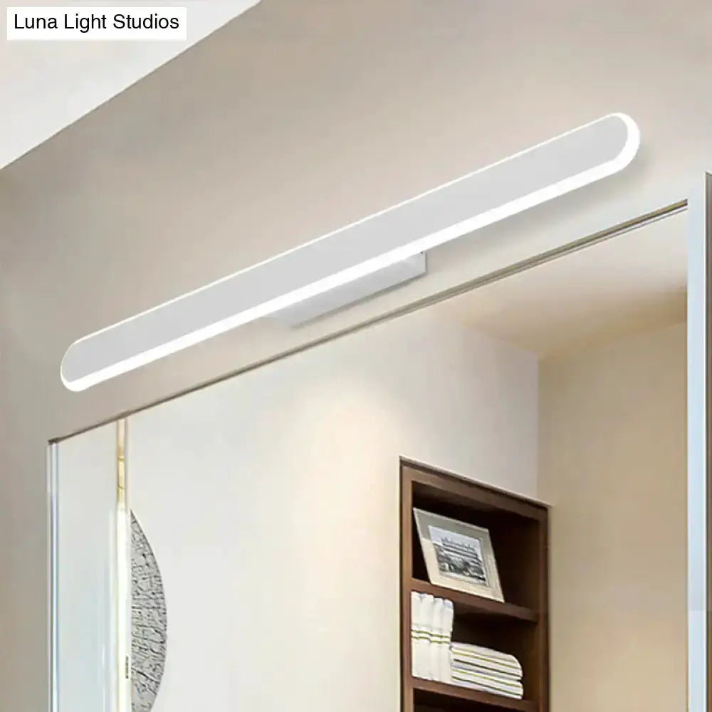 Modern white LED wall light fixture above bathroom mirror Decorbites on Tampa Home & Garden Store