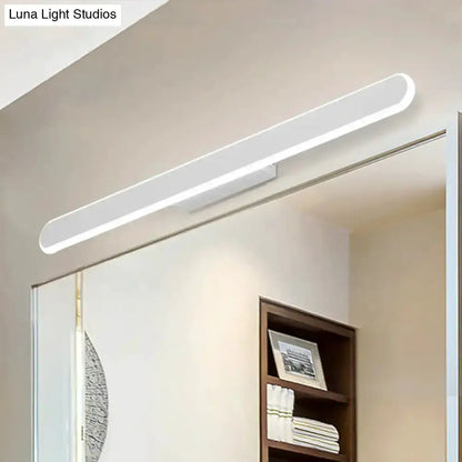 Modern white LED wall light fixture above bathroom mirror Decorbites on Tampa Home & Garden Store