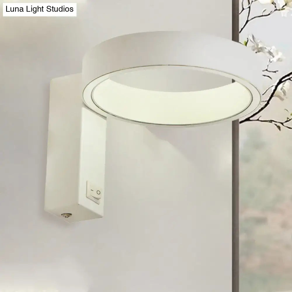 White LED direct-wired wall sconce with circular halo light and rectangular backplate on Tampa Home & Garden Store