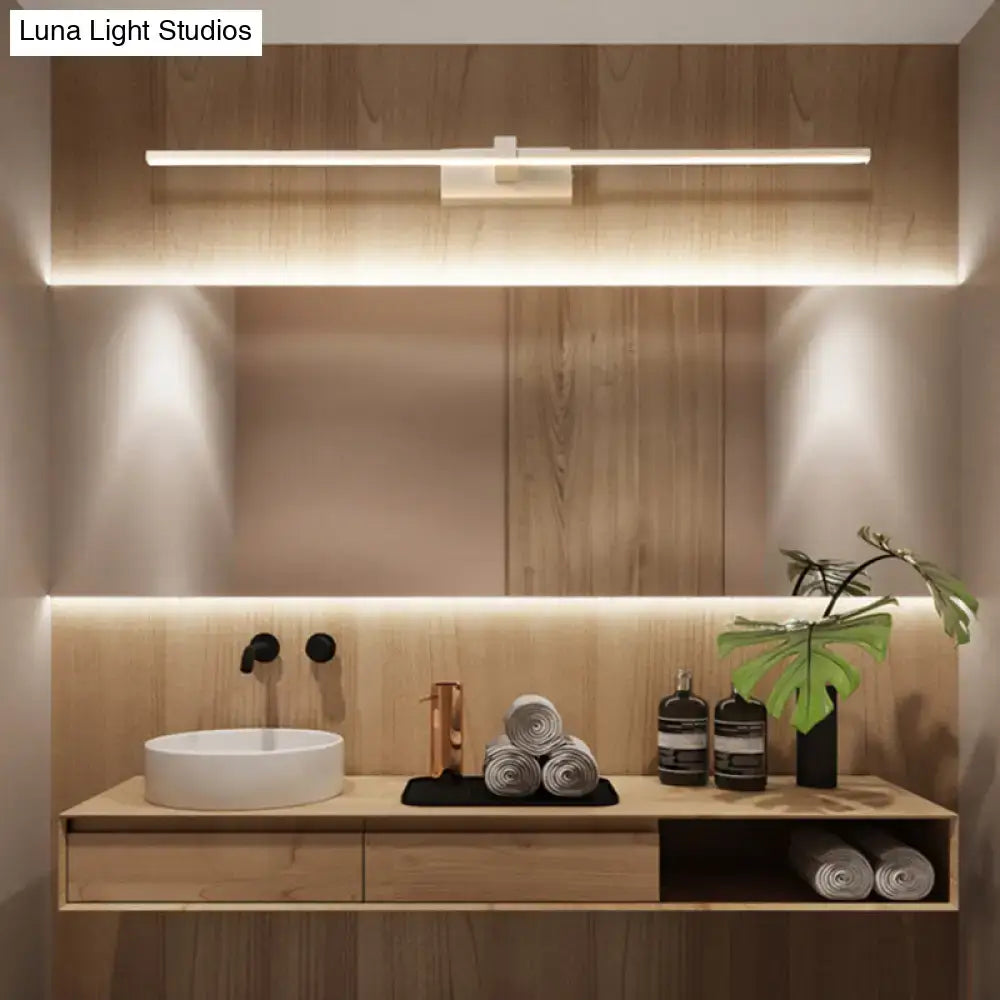 Modern white linear LED wall sconce above a wooden bathroom vanity with round sink on Tampa Home & Garden Store