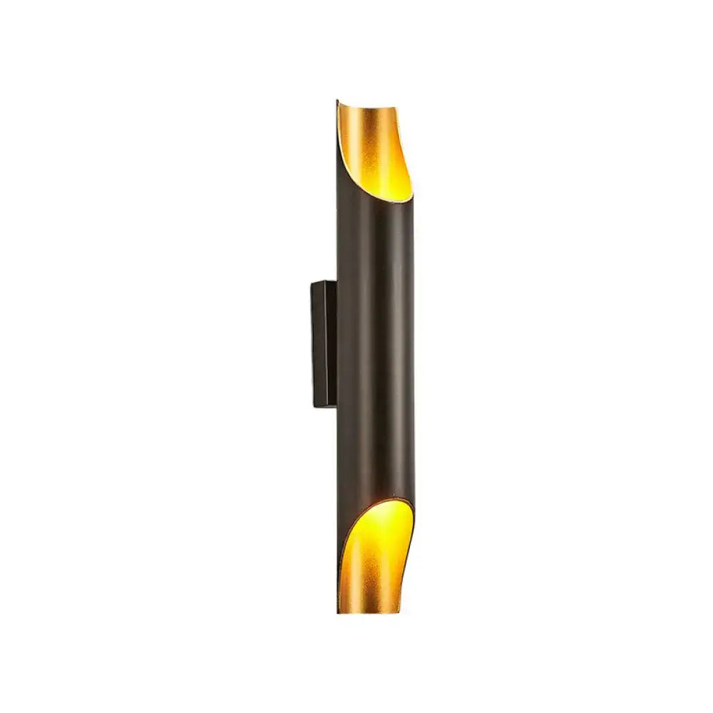 White metal wall sconce with vertical silhouette and gold interior accents on Tampa Home & Garden Store