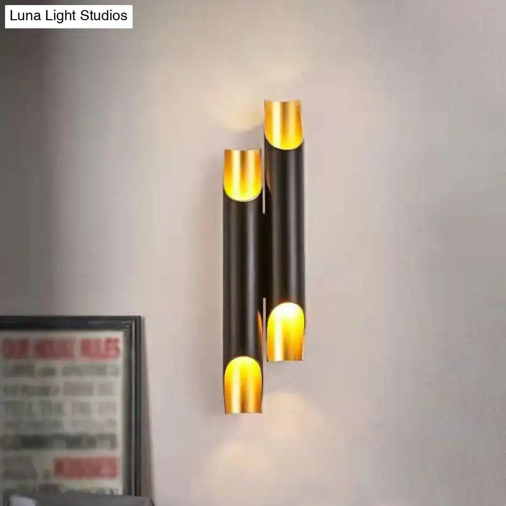 White metal wall sconce with gold interior cylinders in a vertical stack by Decorbites on Tampa Home & Garden Store
