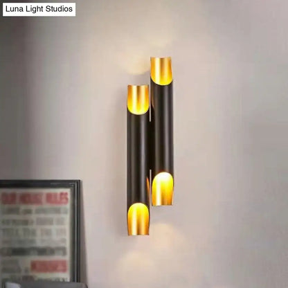 White metal wall sconce with gold interior cylinders in a vertical stack by Decorbites on Tampa Home & Garden Store