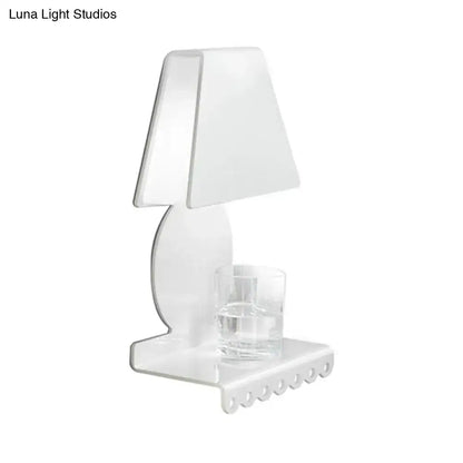 White trapezoid wall sconce by Decorbites with curved backplate and glass votive holder on base on Tampa Home & Garden Store