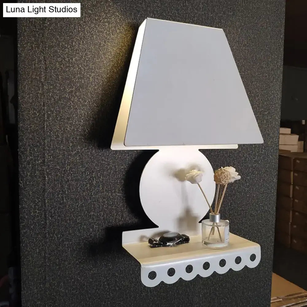 Decorbites white trapezoid wall sconce with circular backplate on Tampa Home & Garden Store