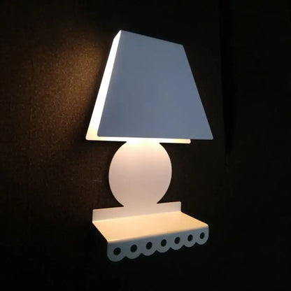 White trapezoid shade wall sconce with round body and scalloped shelf base Decorbites on Tampa Home & Garden Store