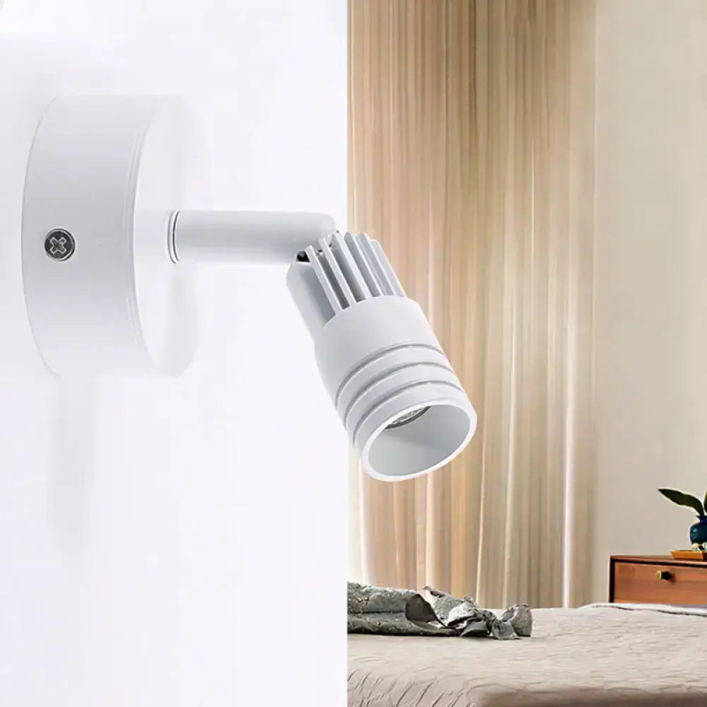 White metal wall spotlight with adjustable cylindrical head, wall-mounted on Tampa Home & Garden Store