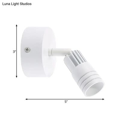 White metal wall spotlight by Decorbites with adjustable head and round mount 5 in span on Tampa Home & Garden Store