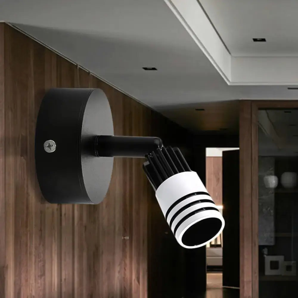 White metal wall spotlight by Decorbites; black wall mount and striped white lamp head on Tampa Home & Garden Store
